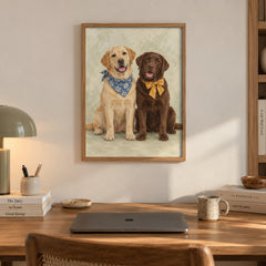 A golden Labrador in a blue bandana sits beside a chocolate Labrador wearing a mustard bow tie, both smiling for the camera — artwork print detail