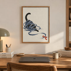 A playful black cat tangled up in a long blue ribbon with a red bow, sketched in a charming textured style — artwork print detail