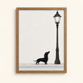 Black dachshund gazing up at a vintage streetlamp — black and white ink wall art print
