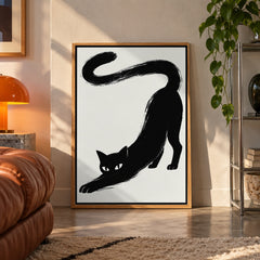Stretching black cat brushstroke poster displayed in a room