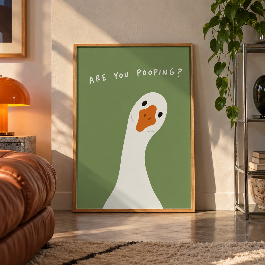 Funny goose bathroom poster displayed in a room