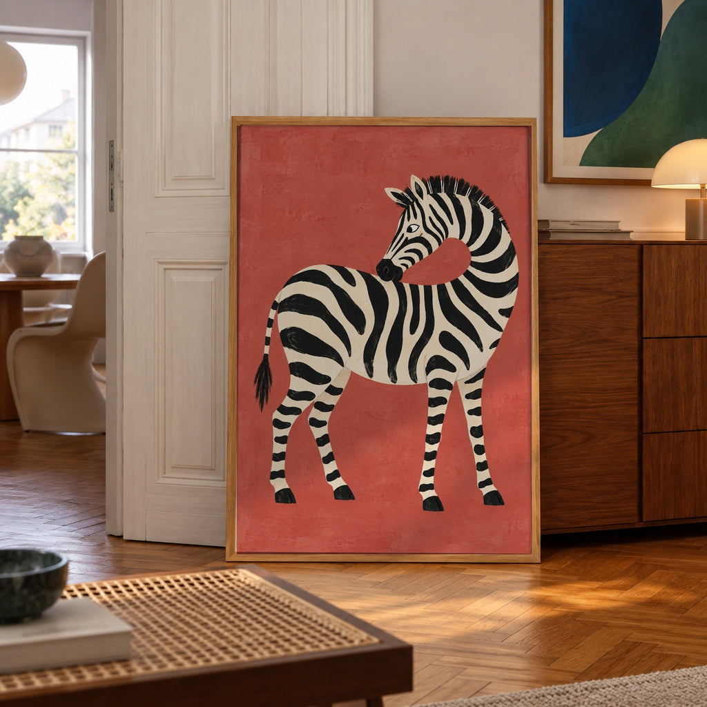 A playful painterly zebra curves its neck against a warm terracotta backdrop — poster displayed in a styled room