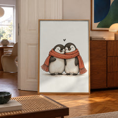 Two sweet penguins huddle close under one cozy red scarf, a tiny heart floating above them — poster in a styled room