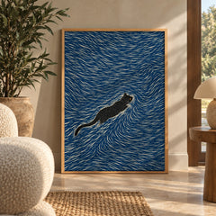 A sleek black cat glides through hypnotic swirling waves of deep indigo and cream — wall art poster display
