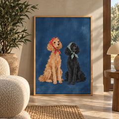 Two charming poodles, one apricot and one black, sit side by side wearing floral bandanas against a deep blue backdrop — wall art poster display