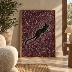 A sleek black cat stretches gracefully through a hypnotic swirl of maroon and cream lines — wall art poster display