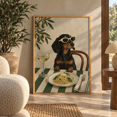 A stylish dachshund dons oversized sunglasses while sitting down to a plate of spaghetti and a glass of wine — wall art poster display