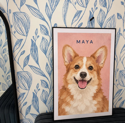 Customer's framed portrait of Maya, a corgi, on a pink background