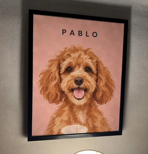 Customer's framed portrait of Pablo, a cockapoo, on a pink background